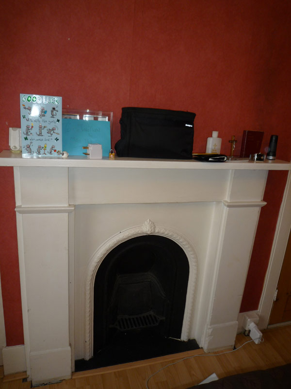 well-wishing card from close friends on our little fireplace